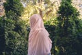 Autumn. Lonely muslim woman in a headscarf walking in a park, garden. Vintage Toned.