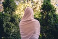 Autumn. Lonely muslim woman in a headscarf walking in a park, garden. Vintage Toned.