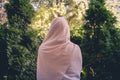 Autumn. Lonely muslim woman in a headscarf walking in a park, garden. Vintage Toned.