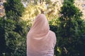 Autumn. Lonely muslim woman in a headscarf walking in a park, garden. Vintage Toned.