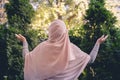 Autumn. Lonely muslim woman in a headscarf walking in a park, garden. Vintage Toned.