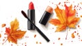 Autumn Beauty Lipstick, Mascara, and Fall Leaves with Watercolor Splatters Royalty Free Stock Photo