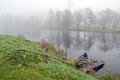 Autumn mist and boat in river Royalty Free Stock Photo