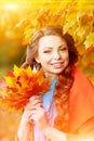 Autumn model, bright make up. woman on background fall landscape Royalty Free Stock Photo