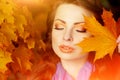 Autumn model, bright make up. woman on background fall landscape Royalty Free Stock Photo