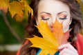 Autumn model, bright make up. woman on background fall landscape Royalty Free Stock Photo