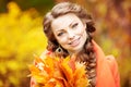 Autumn model, bright make up. woman on background fall landscape Royalty Free Stock Photo