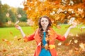 Autumn model, bright make up. woman on background fall landscape Royalty Free Stock Photo