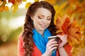 Autumn model, bright make up. woman on background fall landscape Royalty Free Stock Photo