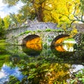 Autumn mood - ancient bridge in Ninfa park Royalty Free Stock Photo