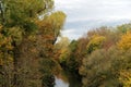 Autumnal colors on trees along a river