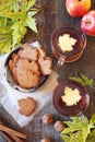 Autumn mood: cinnamon cookies in form of maple leaves, two cups  of tea, red apples and yellow leaves Royalty Free Stock Photo