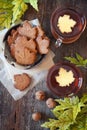 Autumn mood: cinnamon cookies in form of maple leaves, two cups of tea and yellow leaves Royalty Free Stock Photo