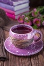 Autumn mood. Fruit tea, books and flowers asters on a wooden background Royalty Free Stock Photo