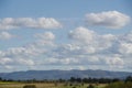 Autumn mood - view over harvested fields to the forest and mountains.Autumn mood - view over harvested fields to the forest and Royalty Free Stock Photo