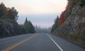 An Autumn morning fog on Highway 60 in Algonquin Park, Canada Royalty Free Stock Photo