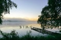 autumn morning by the lake, fog over the surface of the water, a moment before sunrise Royalty Free Stock Photo