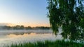 autumn morning by the lake, fog over the surface of the water, a moment before sunrise Royalty Free Stock Photo