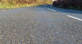 Wet country road in sunshine. Sunny November in the South West of the UK Royalty Free Stock Photo