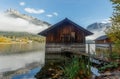 Autumn morning scene On lakeAltausseer See . Fishing Hut in Water Incredible Alpine lake. Foggy landscape of lake in Royalty Free Stock Photo