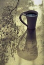 Autumn morning still life. White cup of coffee on  table. Shadow and sunlight. At home. Rustic style, Lazy weekend. Haze vintage Royalty Free Stock Photo