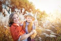 Autumn. Mother and baby boy (child, kid) having fun outdoors on the fall city park. Royalty Free Stock Photo