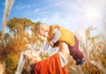 Autumn. Mother and baby boy (child, kid) having fun outdoors on the fall city park. Royalty Free Stock Photo