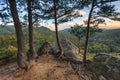 Autumn mountain forest with pine trees and rocks on foreground at sunset. Beautiful scenery. Plancheskiye Rocks, Seversky district