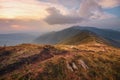 Autumn mountain landscape. Mountain path on the sunset sky background. The way of climax. Mountain slope have a way for walk.