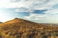 Autumn mountain landscape nature photography highland grassland meadow and cloudy blue sky scenic view in October season Royalty Free Stock Photo