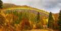 Autumn mountain landscape with a rainbow after the rain Royalty Free Stock Photo