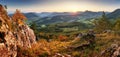 Autumn mountain panorama landcape with forest at sunset