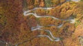 Autumn mountain zigzag road view from above