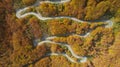 Autumn mountain zigzag road view from above