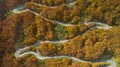 Autumn mountain zigzag road view from above