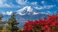 Autumn mtfuji tallest volcano in tokyo, japan with snow capped peak and red trees