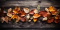 Autumn multicolored leaves over wooden aged shabby background