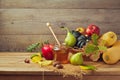 Autumn nature concept. Fall fruits and pumpkin on wooden table. Thanksgiving dinner Royalty Free Stock Photo