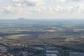 Autumn nature view from mountain to the horizon with hills and mountains and cloudy sky and industrial city and highway Royalty Free Stock Photo