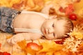 Autumn newborn. Autumn time scene. little baby with red yellow