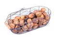 Autumn nuts in a metal basket isolated