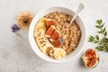 Autumn oatmeal with banana, fig and flax seed. White background, top view Royalty Free Stock Photo