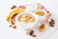 Autumn oatmeal in white bowl banana honey