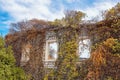 Autumn, oldness. Wall with windows of old ruined house Royalty Free Stock Photo