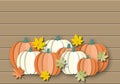 Autumn of orange and white pumpkins with colourful leaves on dark wood banner background. Royalty Free Stock Photo