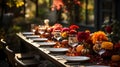 Autumn outdoor dinner table setting with flowers and pumpkins, vertical, fall harvest Royalty Free Stock Photo