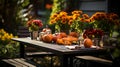 Autumn outdoor dinner table setting with flowers and pumpkins, vertical, fall harvest Royalty Free Stock Photo