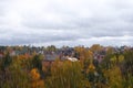 Autumn on outskirts of city. Bright blue sky with thick clouds. September, October, November. Rainy day Royalty Free Stock Photo