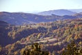 Autumn over hills covered with trees