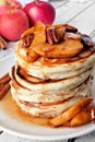 Autumn pancake stack with baked apples, pecans and cinnamon Royalty Free Stock Photo